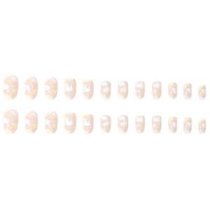 Short round press-on nails with nude pink base, white clouds and yellow star patterns