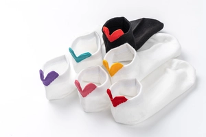 Assorted cotton ankle socks with colorful heart shaped heel tabs in various vibrant colors