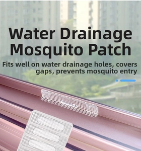 Close-up of mesh drainage hole cover sticker on window frame for mosquito protection
