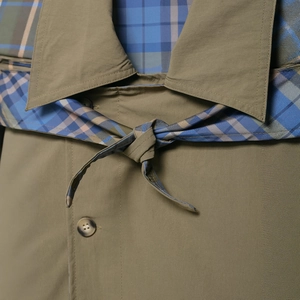 Fashionable British style khaki windbreaker with vintage blue plaid lining and waist tie