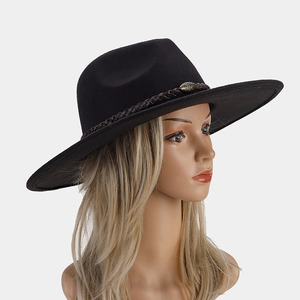 Close-up of black wool fedora featuring a woven leather band and bronze metal buckle detail