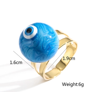 Detail of gold evil eye ring showing 1.6cm blue enamel globe and adjustable open band