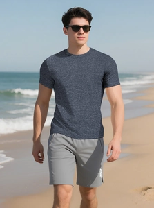 Close-up of a men's breathable dark grey marl gym shirt and light grey athletic shorts