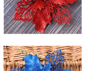 Detailed view of red and blue glittered artificial poinsettia flowers for Christmas decor