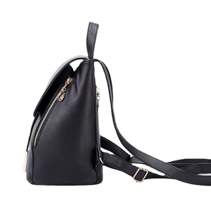 Side view of black textured PU leather backpack with gold zippers and adjustable straps