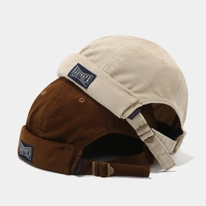 Retro corduroy docker hats in beige and brown with adjustable metal buckle back straps
