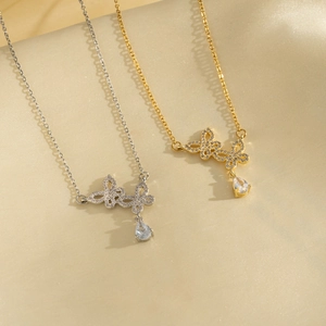 Titanium butterfly zircon necklaces in gold and silver set on elegant beige silk fabric