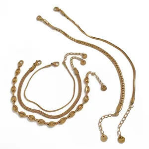 Golden stainless steel jewelry set featuring herringbone and coffee bean chain link styles