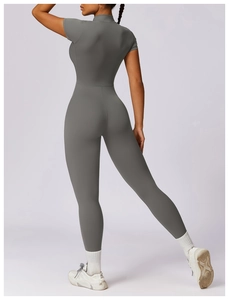 Macro shot of dark grey yoga bodysuit featuring slim fit cut and seamless stretch fabric