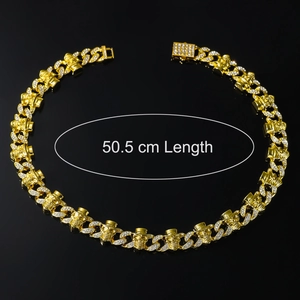 Detail of 50.5cm gold iced out Cuban chain with skull links and sparkling rhinestones