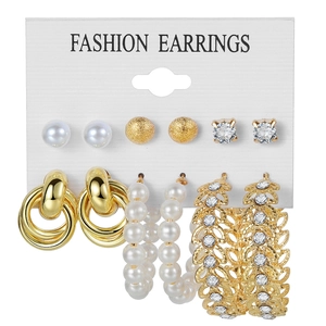 Detailed close-up of a 6-pair gold earring set featuring pearls and crystal studs