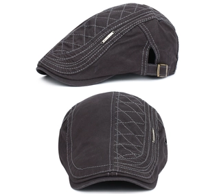 Detail view of dark grey cotton ivy cap showing diamond stitching and metal buckle strap