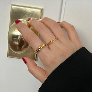 925 silver gold-plated twisted ring set on hand with minimalist aesthetic
