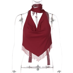 Detailed view of burgundy cowl neck halter top featuring elegant fringe tassels