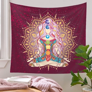 Detail of bohemian mandala tapestry featuring seven chakra symbols and a meditation pose