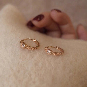 Macro shot of rose gold plated sterling silver earring with square cubic zirconia stone