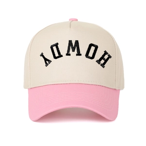 Close-up of HOWDY letter embroidery on two-tone beige and pink cotton baseball cap