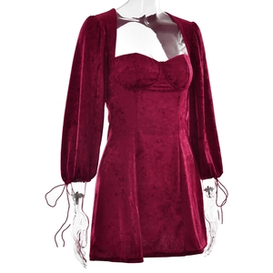 Detailed view of burgundy velvet mini dress with lace-up cuffs and square neckline