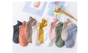 Detailed flat lay of ten colors of cartoon dog embroidery cotton ankle socks with props