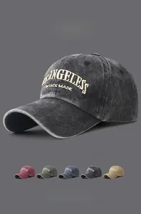 Detail of vintage washed cotton baseball caps with 3D embroidery in five colors