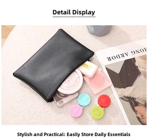 Detail showing the inner capacity of black lychee texture PU leather makeup storage pouch