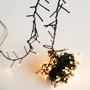 Warm white LED string lights with black wire for Christmas tree and indoor decoration