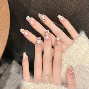 Winter snowflake press-on nails with pearls, rhinestones and glitter in nude and gold