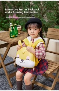 Detail of yellow cartoon bunny schoolbag with 3D ears held by child outdoors