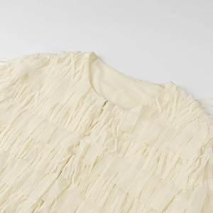 Women's cream round neck long sleeve top featuring tiered fringe textured design