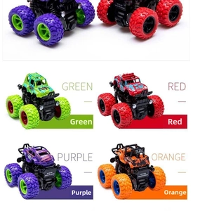Detail of four-pack friction powered monster trucks with shock springs and large tires