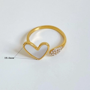 Detailed close-up of a gold open ring featuring a 10.4mm pearl heart and zircon accents