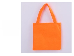 Detailed rear view of a vibrant orange non-woven fabric Halloween candy gift tote bag