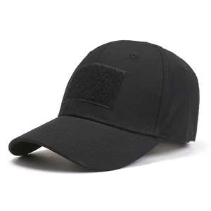 Detail of black tactical baseball cap featuring ripstop fabric and front velcro patch