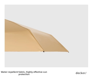 Detail of water-repellent umbrella fabric in champagne gold with UV protection coating