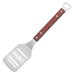 Detail of stainless steel BBQ spatula with wooden handle and integrated bottle opener