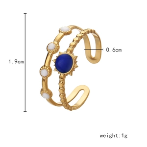 Detailed view of gold open ring with blue stone and size specs: 1.9cm height, 1g weight