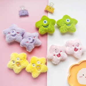 Colorful plush star monster dolls with embroidered expressions in purple, green, pink and yellow