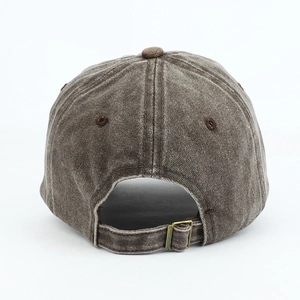 Detail of adjustable metal buckle and stitching on vintage washed cotton baseball cap