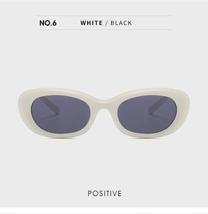 Front view of retro oval white sunglasses with black lenses from the No.6 collection