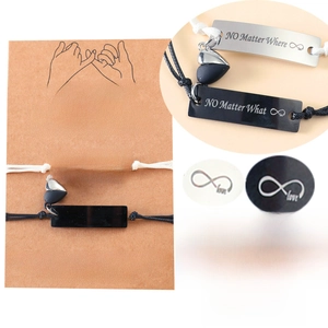 Detail of stainless steel magnetic couple bracelets with infinity love heart charm