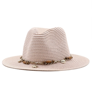 Women's straw Panama hat in soft pink with bohemian shell and wood bead trim
