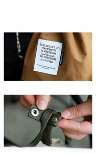 Close-up of decorative label and handle snap button on insulated lunch bag