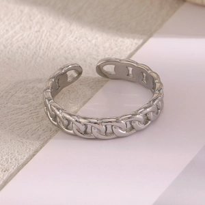 Macro shot of silver chain texture on an adjustable open ring in minimalist style