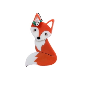 Cute orange and white cartoon acrylic fox brooch with small flower decorations on white background