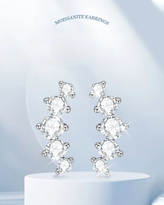 Detail of Moissanite curved stud earrings in 925 sterling silver with a radiant fire effect