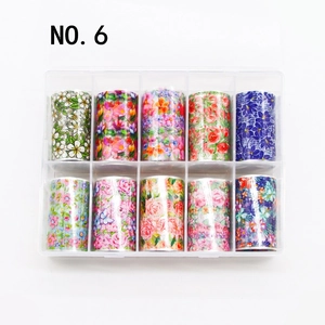 Detailed view of 10-roll floral nail art foil transfer set in a clear plastic storage box