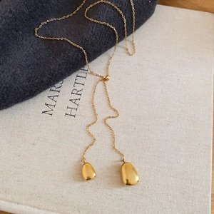 Detail of 18k gold plated water drop pendants on adjustable Y-shaped necklace chain