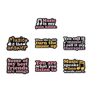 Set of seven colorful music enamel pins with inspiring English quotes and notes