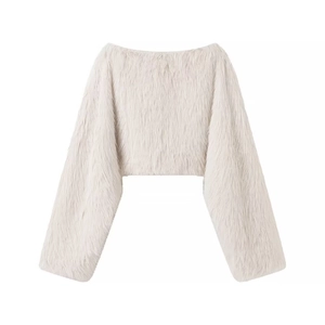Close-up of soft off-white faux fur texture and off-shoulder cropped sleeve design