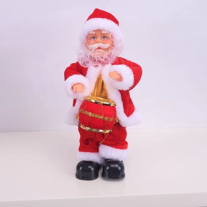 Detail of animated Santa Claus plush toy with musical drum on a plain white backdrop